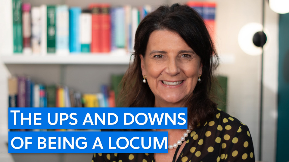 Locum optometrist Francesca Marchetti smiles at the camera in front of a bookcase