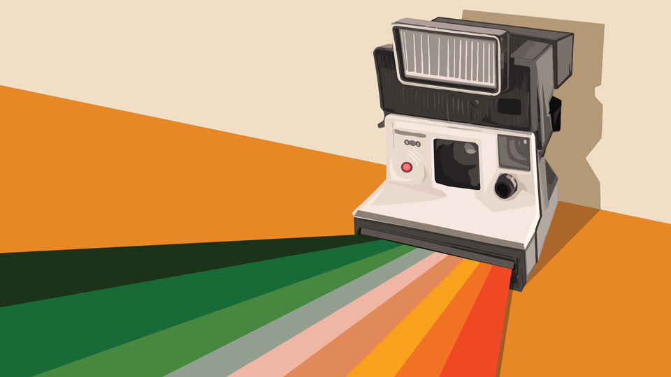 A vintage style polaroid camera dispensing a rainbow instead of a photograph