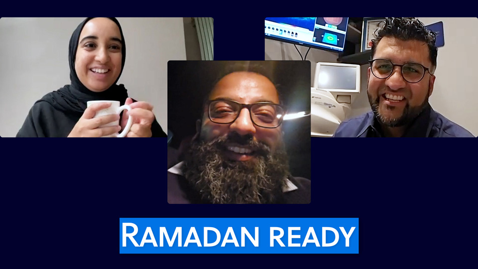 Three images of video calls are displayed on a blue backdrop. In the first image on the top left a woman in a black hijab smiles while holding a white mug. In the central lower image, a man with a beard and spectacles is pictured. In the third top right image, a man wearing spectacles and a navy shirt sits in a testing room. Behind him is optometry equipment and a flat screen displaying images of a retina.