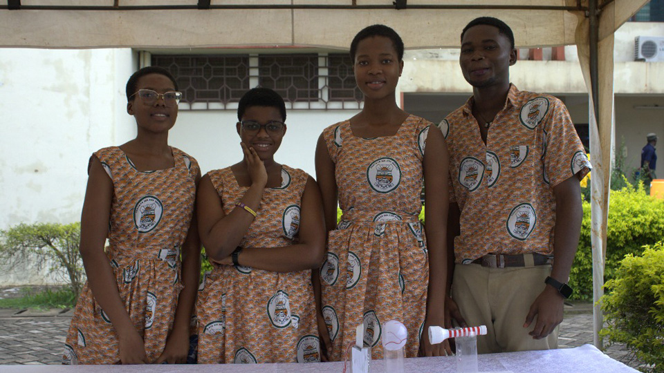 A group of school children with the model eye they created for a competition as part of World Optometry Day celebrations