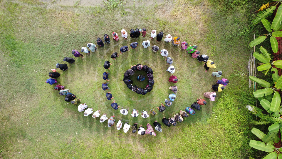 Staff from Sightsavers Bangladesh form an #EyeCreation