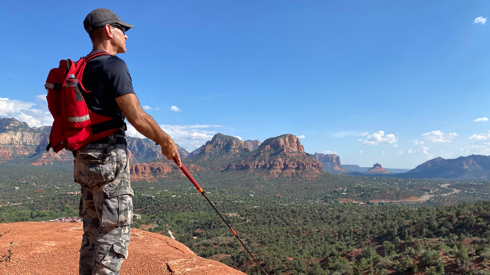 Dave Epstein standing at the edge of a cliff using the ATC