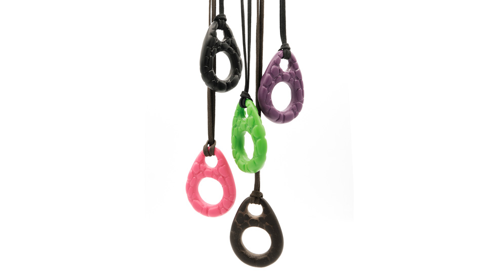 The new Coti Vision necklace holders are teardrop shapes in bright colours with a circular hole for eyewear to be secured. The texture of the charms is bubbly