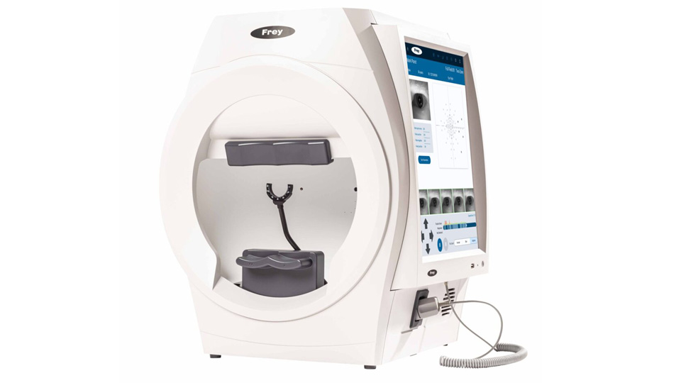 A white device with circular head and chin rest and a screen on one side displaying testing details and simulated results