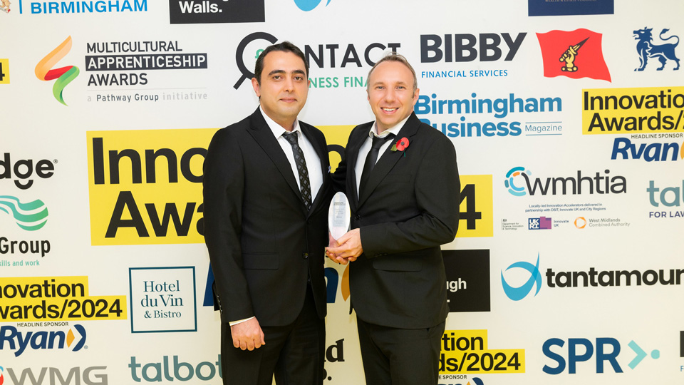 Karl and Masoud pose with the Innovation Award