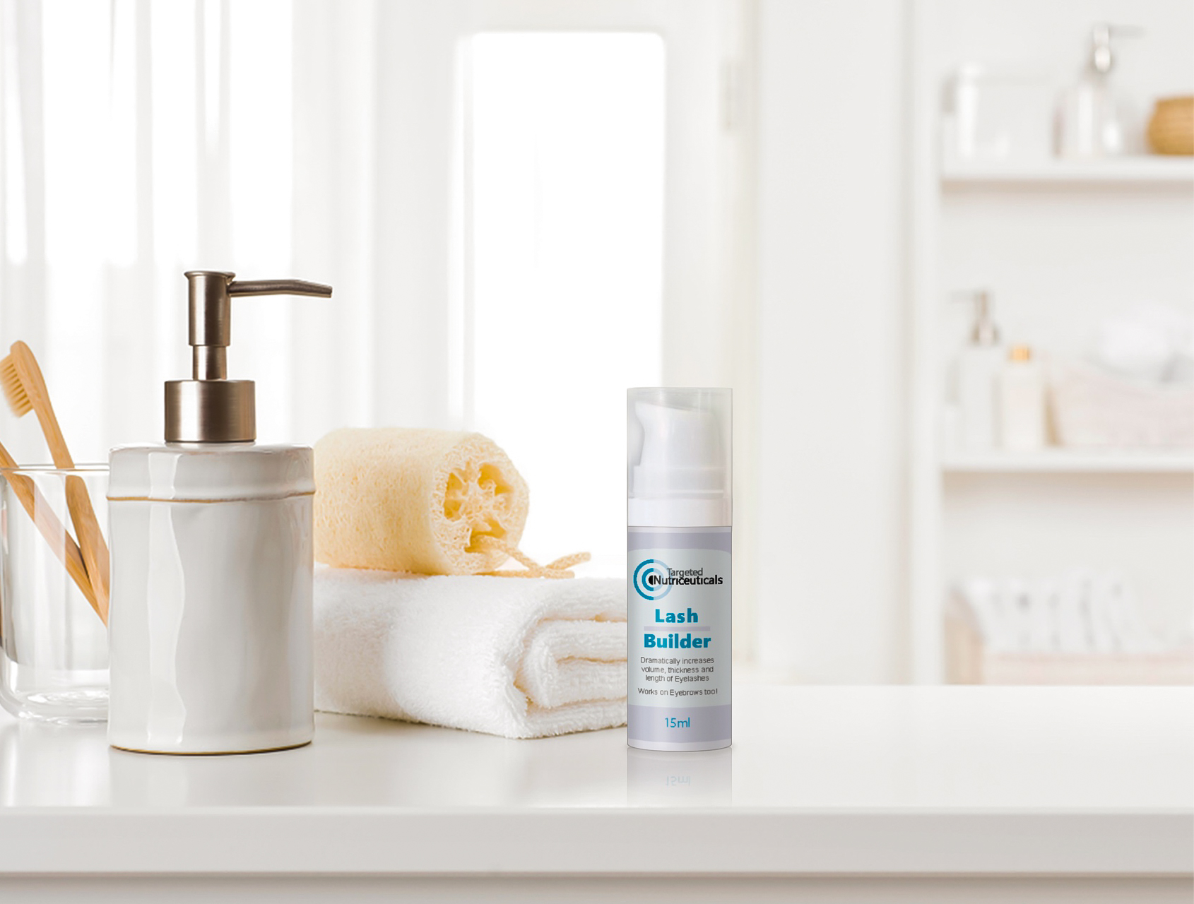 A grey serum bottle with pointed nib is presented in a bathroom setting beside a hand soap dispenser, towel and toothbrushes