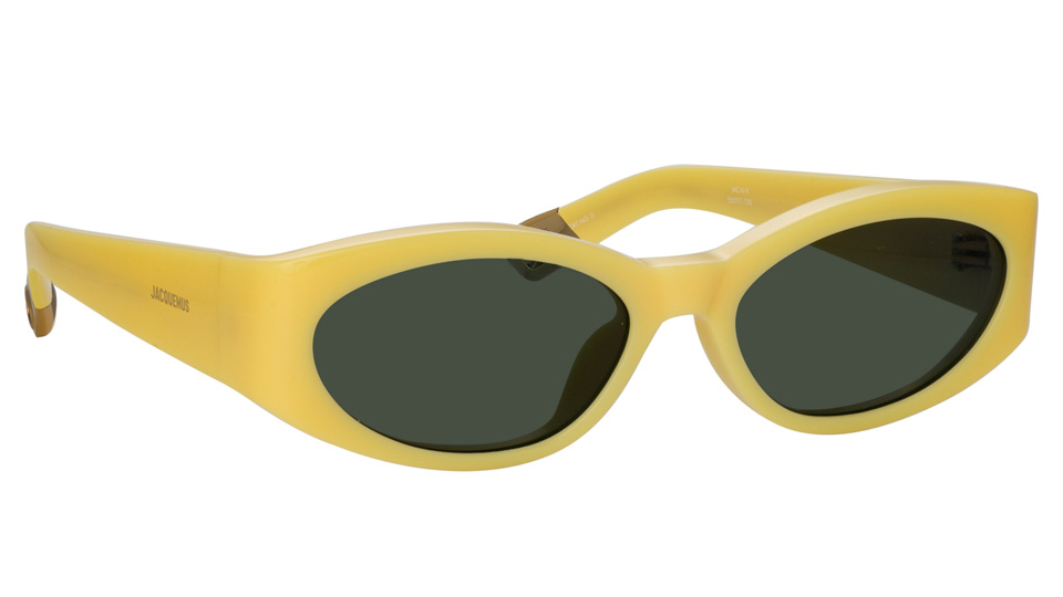 A pair of oval sunglasses in yellow with green lenses