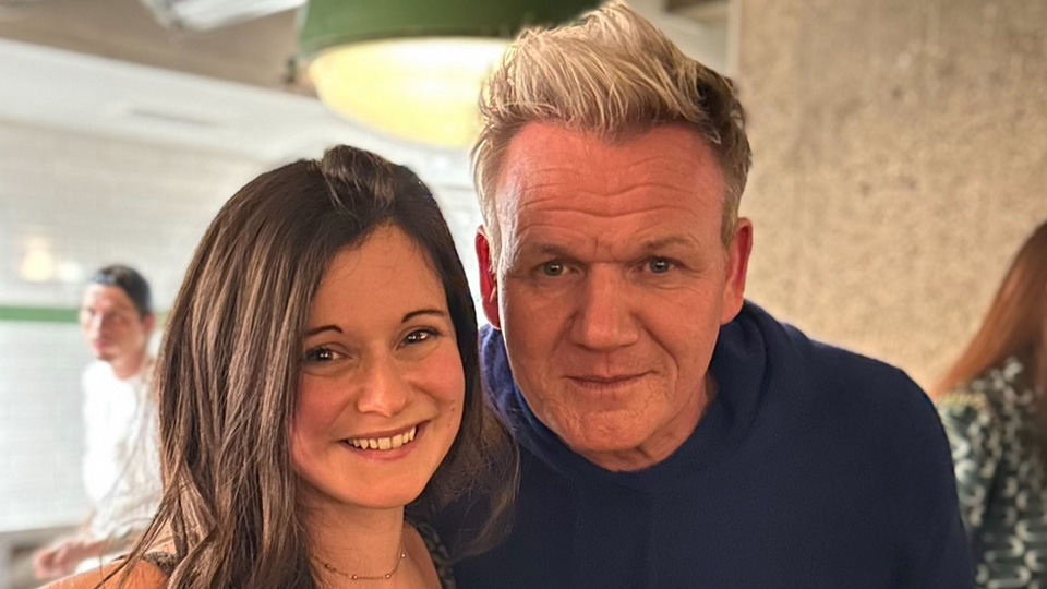 Clare poses with Gordon Ramsey, both are smiling 