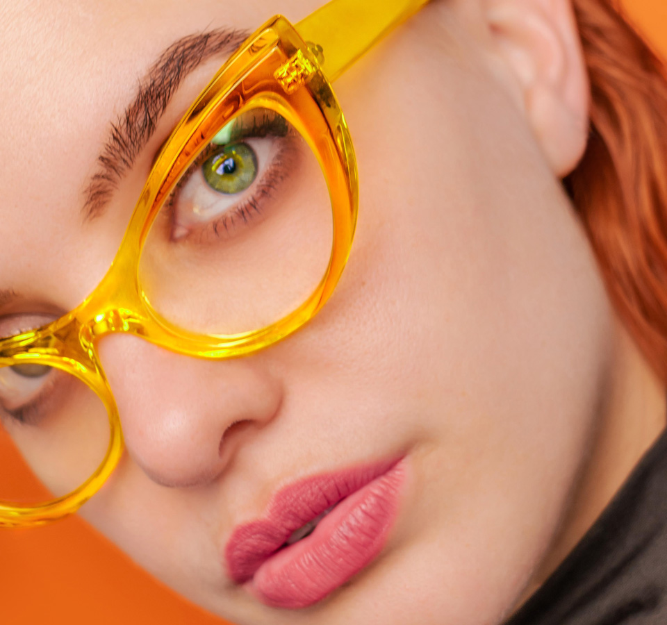 Model wearing orange frames