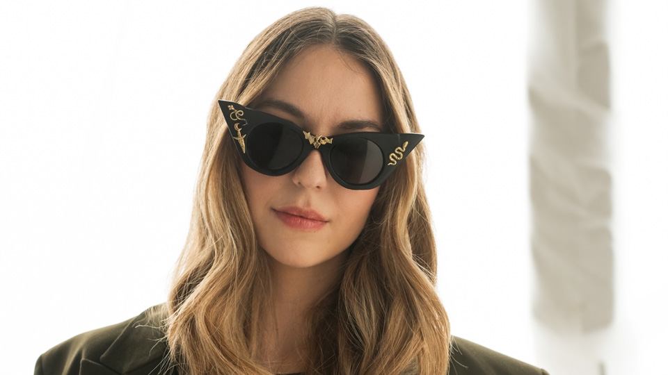 woman wearing large sunglasses