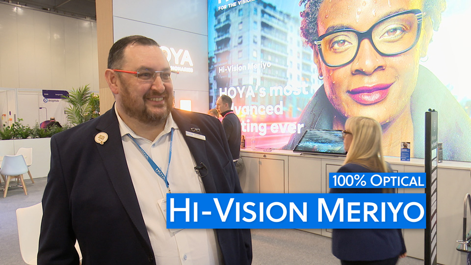 Keith Elliott, regional sales manager for Hoya Lens UK, smiles on the Hoya stand at 100% Optical 2024
