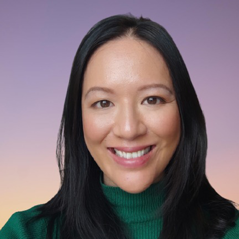Denise Voon is pictured wearing a green turtleneck sweater