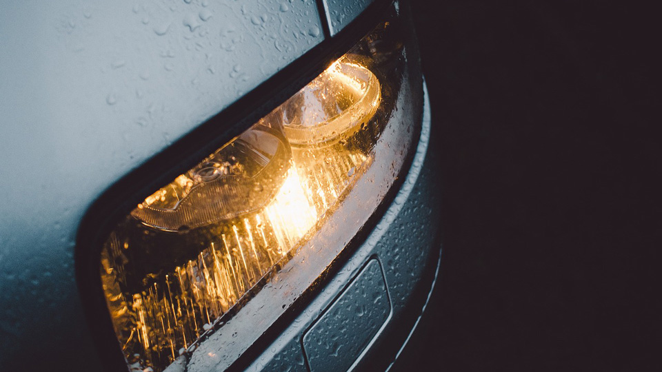 A car headlight in a dark night