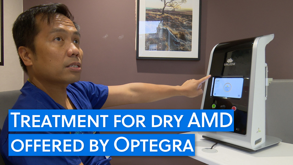 A clinician points at the Valeda light therapy device