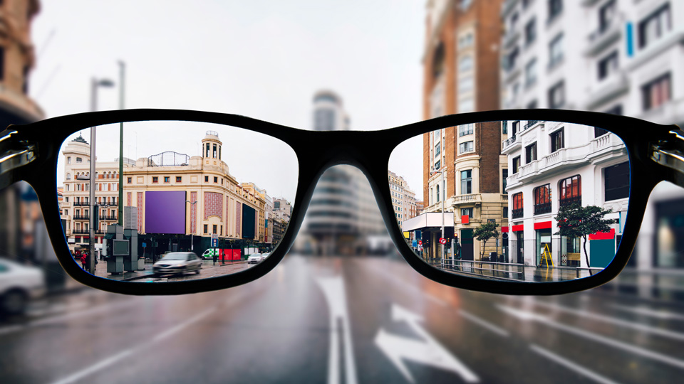 A city centre is more clearly seen through myopia lenses with a black frame  