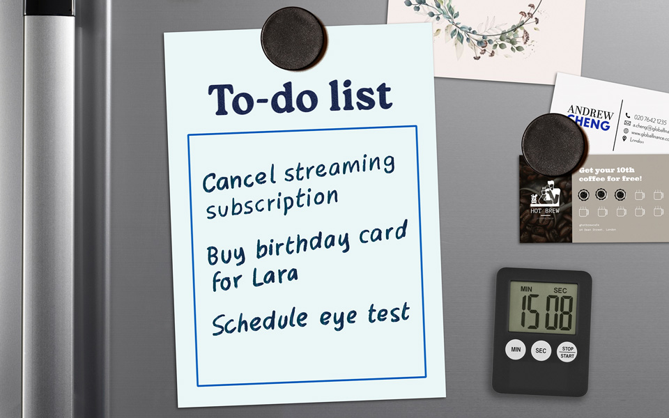 A fridge with an array of items including a to-do list, the last of which is a reminder to schedule an eye test