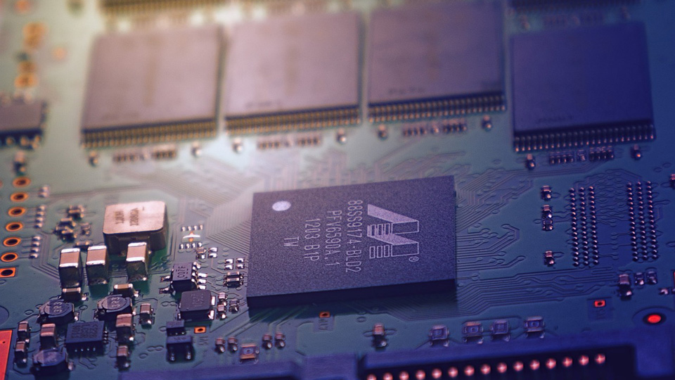 The components of a computer chip are displayed close up 