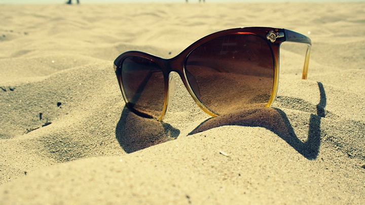 Sunglasses in the sand