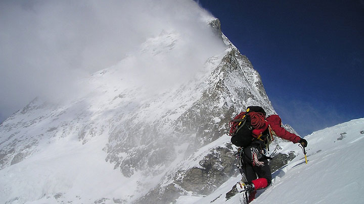 Man climbing a mountain