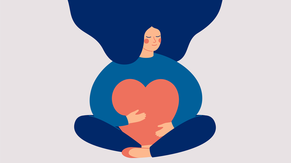 person hugging a heart pillow