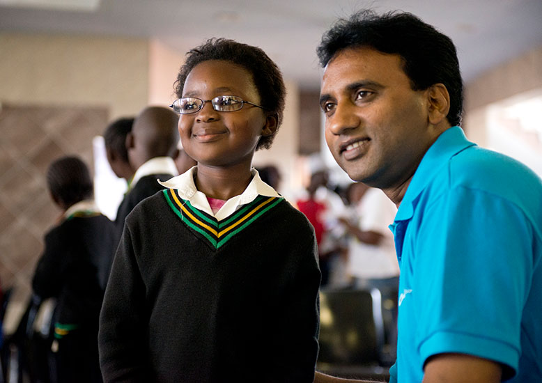 A child pictured (left) and Professor Kovin Naidoo pictured (right)