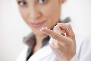 Contact lens on finger