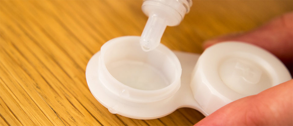 Contact lens case and solution