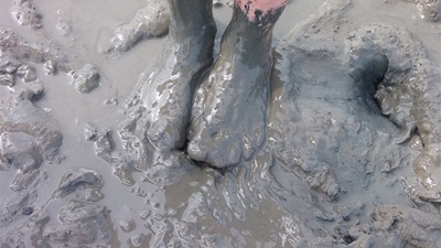 Feet covered in mud